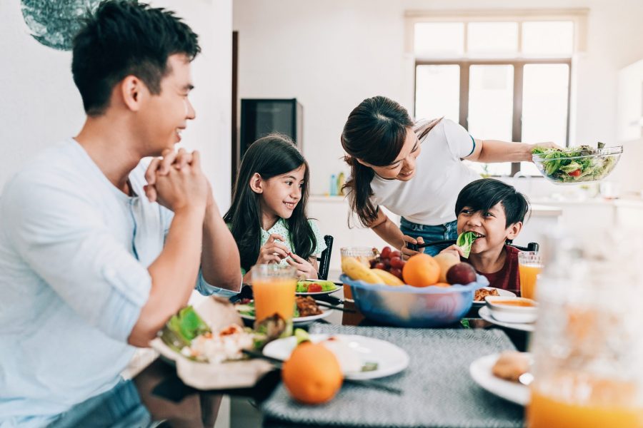 Asian ethnicity family having breakfast at home